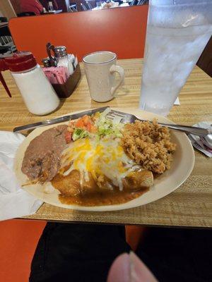 Chicken Enchilada Plate, which included refried beans, salad, and rice.