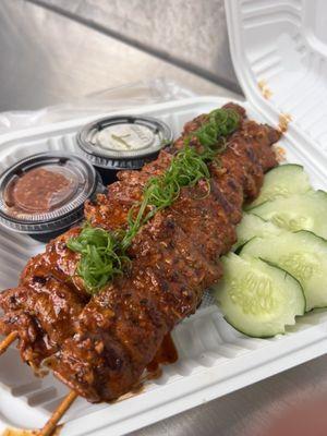 Beef skewers with sticky rice.