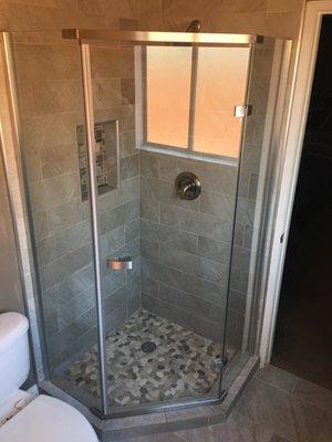 Installation of custom shower door.