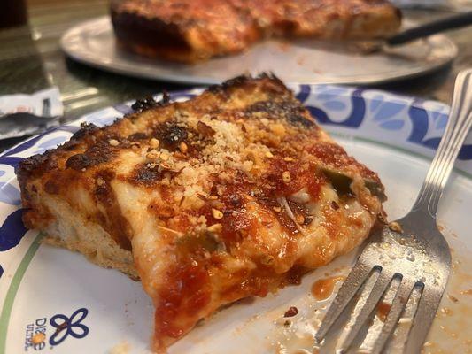 Deep dish you can eat with your hand or cut with your fork