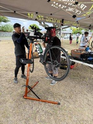 2024 HCR Aid Station at Kailua Middle. Bike repairs by the Bike Shop.