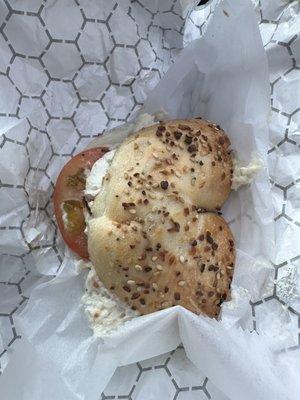 Everything bagel w/ cream cheese, white fish salad, tomato and onion