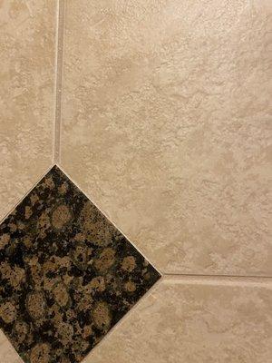 Horizontal line is as far up as they worked on in the master bath. Above the Diamond tile was not touched at all.