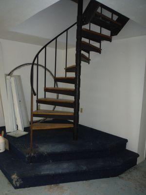 Spiral staircase with landing, before.