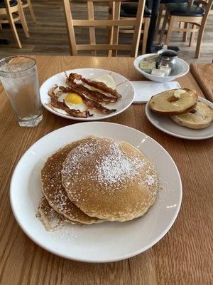 Classic Pancakes, eggs, bacon and a toasted bagel.