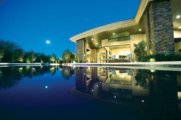 Majestic black bottom pool with Star glow lighting throughout the pool. Beautiful contemporary home.