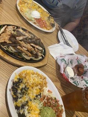 Combo dinner - burrito, enchilada, and tamale. Chick/steak fajitas that come with guac, pico,cheese, beans and rice. Stuffed tater tots