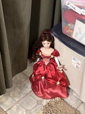 Very cute doll in a red beautiful gown