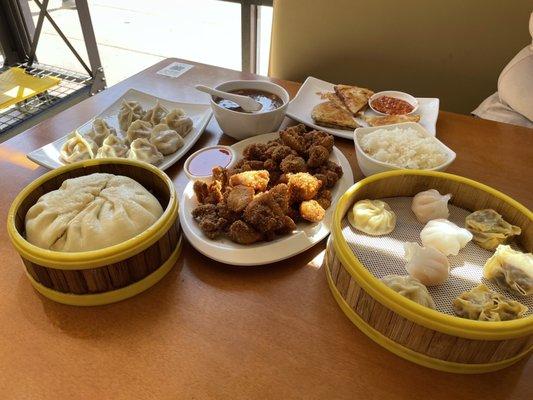 Dim sum combo, crispy chicken, pan fried dumplings, scallion pancakes, hot and sour soup, big bun.