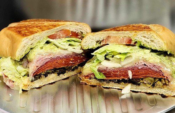 Ham, pepperoni, salami, provolone cheese, lettuce, tomato, onion, mixed olives, capers, Italian dressing, and lemon basil aioli.