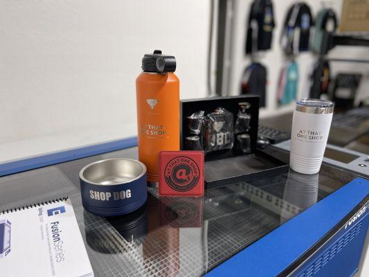 Custom gear we have previewed are pet bowls, water bottles, flasks, & a wallet!