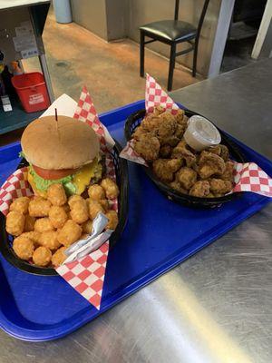 The just a burger with cheddar cheese and tots, with a side of fried mushrooms