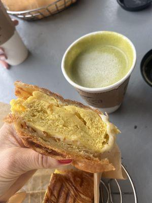 Egg & Cheese on croissant Matcha Latte with oat milk