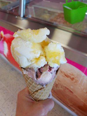 Cone with two big scoops-- Gansito (chocolate twinkie flavor) on bottom and pina colada on top. All for $3