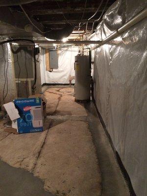 this is just part of basement. white plastic on walls is the new vapor barrier.  Basement is VERY dry!