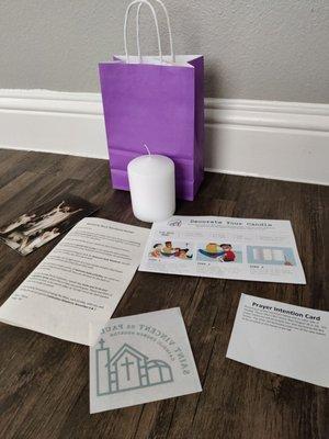 Welcome Back Weekend Packet includes a cool candle activity, a decal, Prayer Intention Card, etc.