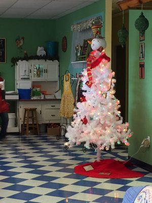 Love the blue & white floor, white Christmas tree and white cabinet.