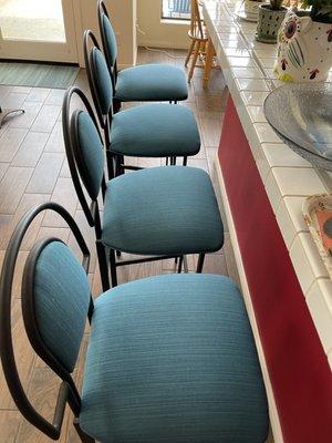 The reupholstered bar stools.