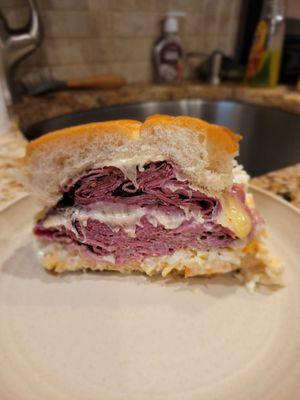 The Grandslam Pastrami, corn beef, melted Swiss, coleslaw, and Thousand Island dressing.