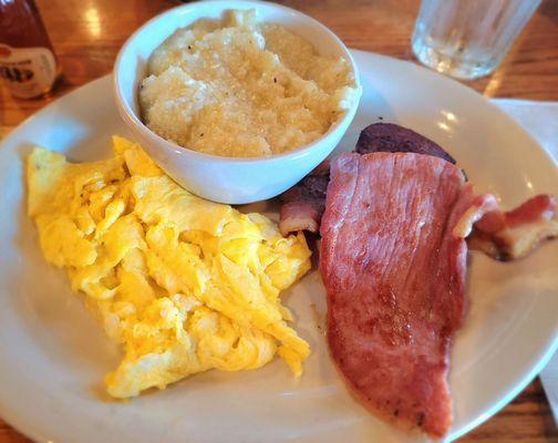 Scrambled Eggs, Country Ham, Bacon, Sausage Patty, and Grits (yum)