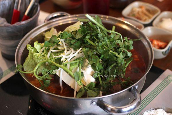 Gamjatang A  ($37.95) - Pork backbone soup w/ potatoes, tofu, napa, watercress, beansprouts