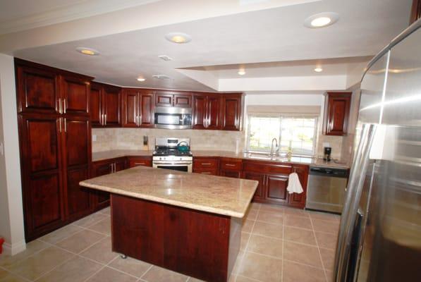 Kitchen remodel in Yorba Linda with custom cabinets, granite countertops and marble backsplash.