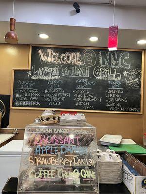 Some of their fresh baked goodies and a chalkboard with places to see, go and do in and around NYC