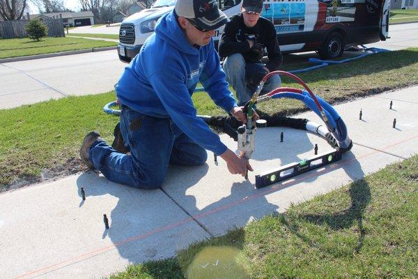 sidewalk raising repair