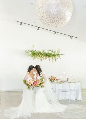 Wedding reception room at South Haven Creations with two brides.