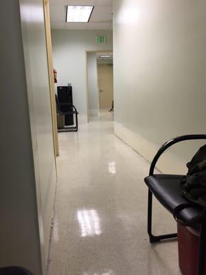 This the hall way they have you wait in when the waiting room is full. I would be embarrassed to be a doctor here.