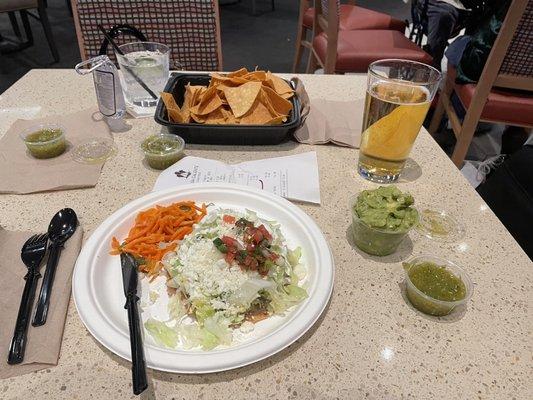 Classic Tostada with chips, salsa and guacamole and ice cold, draft beer