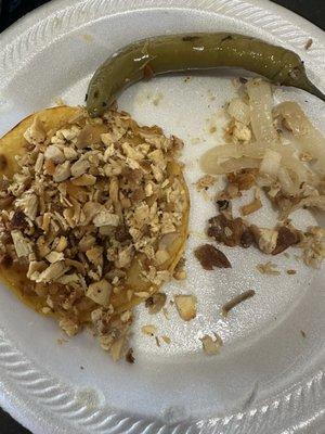 Dry chicken, hard pieces of meat, piece of bone found in taco