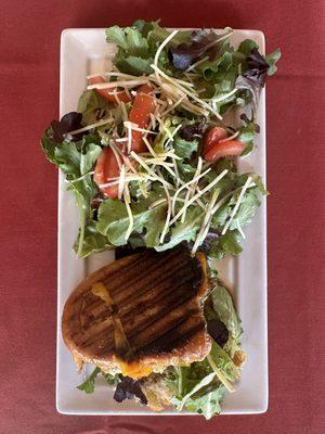 Half chicken pesto panini w/ a side salad.