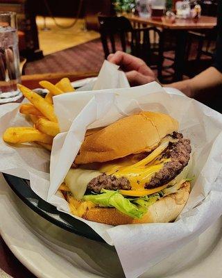 Signature Burger: 1/3lb burger topped with American & Swiss Cheese, Chipotle sauce, lettuce, tomato, onion, pickle chips