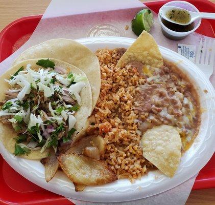 One carnitas taco, nice and moist Spanish rice, very flavorful beans and a nice little side of grilled onions. Yummy!