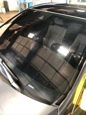 Acid etched windshield due to products they used