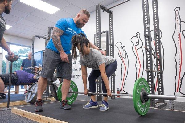 The deadlift is correctly performed with hips high.