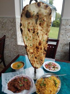 Peshawari naan with chicken biryani, butter chicken and chapali kabab.