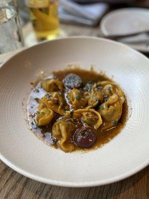 Liberty Duck Confit Pansotti, Charred Onion + Marsala Sauce, Swiss Chard