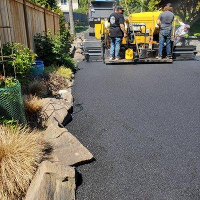 The crew applied new asphalt in between the stones to help with drainage.