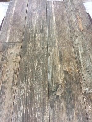 Wood look tile offers the visual of a beautiful hardwood floor with the durability of a tile floor. Best of both worlds...