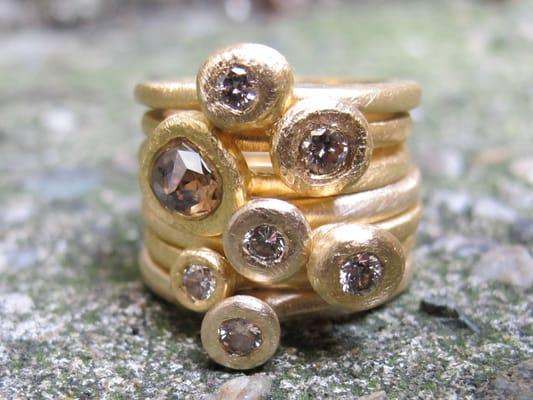 Custom 18k stacking rings using clients metal and diamonds.