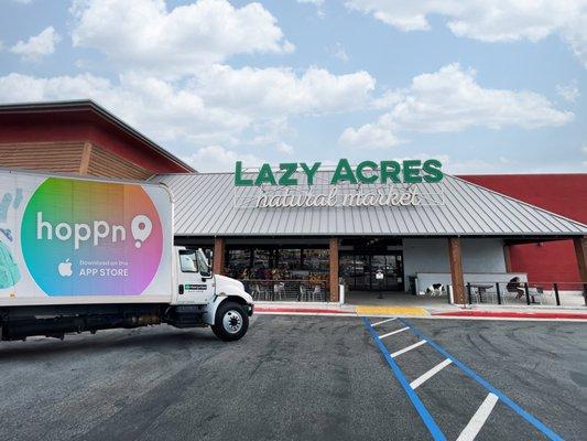 Exterior of Lazy Acres natural market in Hermosa Beach. Hoppn Truck in the foreground