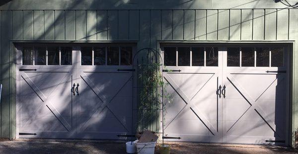 Overlay Carriage Garage Door with Decorative hardware.