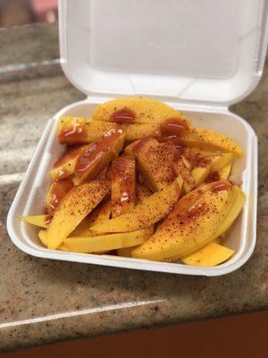 Mango box with chamoy and tajin. Highly recommend.