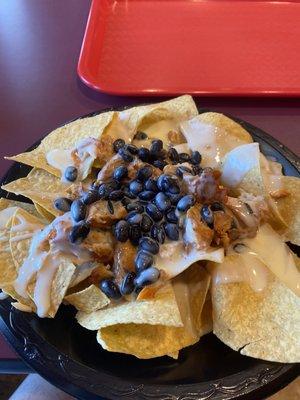 simple chicken nachos, I only get the tasty, seasoned and cooked perfectly chicken with black beans and queso!