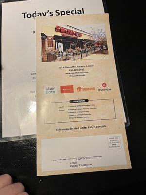 Physical menu is mail flyer, but they have QR at tables for online menus.