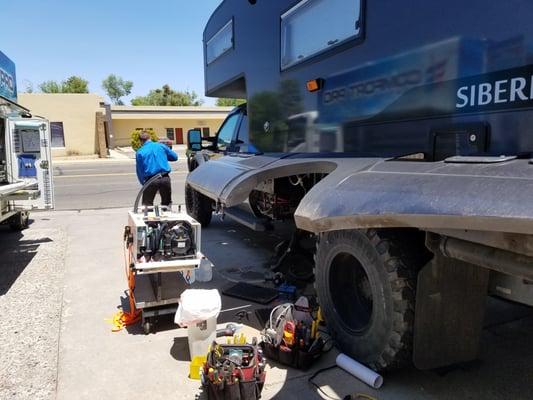 Comfort Pro working to install a new Aquahot heating system on our Siberian Tiger 4x4.