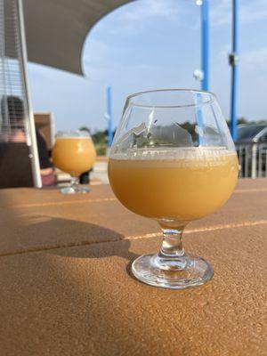 Mr. Balloon Hands, a hazy American IPA, enjoyed outside on the patio.