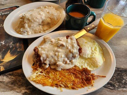 Country Fried New York Steak w 3 eggs and biscuits and gravy. Crispy hash browns. Coffee and orange juice.  About $20